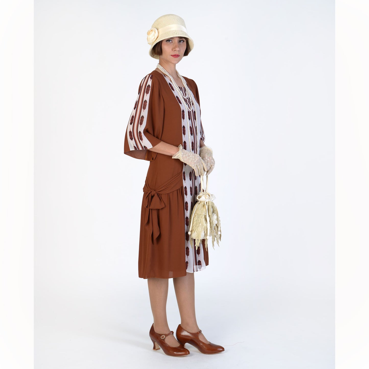 This art deco fashion dress, or Gatsby dress or Downton Abbey dress, is made with a combination of solid dark brown crepe georgette fabric