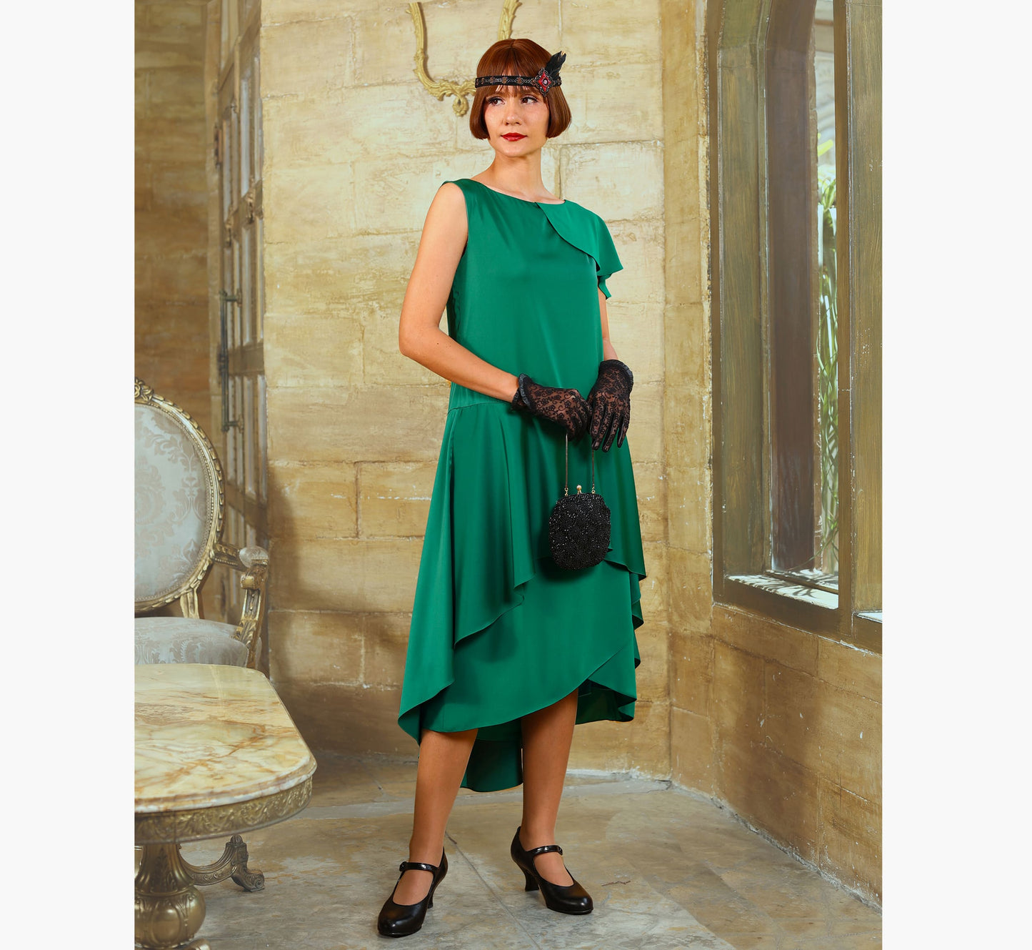 This satin 1920s evening dress, or formal Great Gatsby dress, with a shoulder train is made with a combination of green chiffon and satin.
