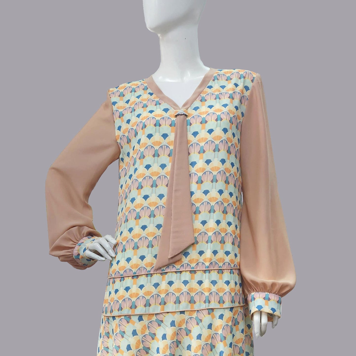 1920s dress with Playful Pastel Art Deco Print and brown Contrast