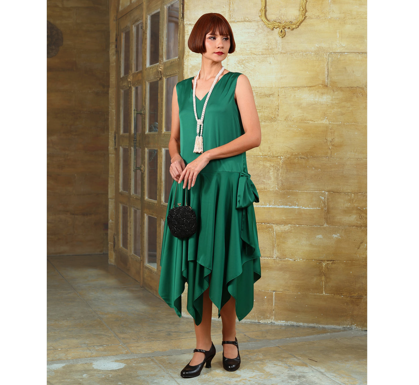 Green satin 1920s evening dress with handkerchief skirt. The flapper can be worn as a Charleston dress, Great Gatsby dress or Jazz Age lawn party dress.