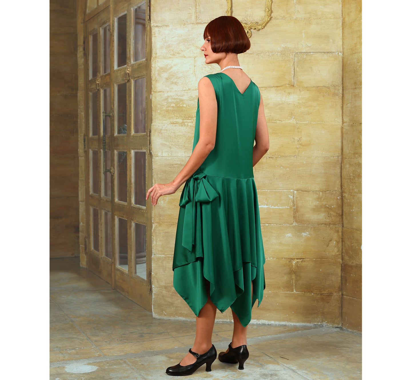 Satin roaring 20s party dress in green with handkerchief skirt