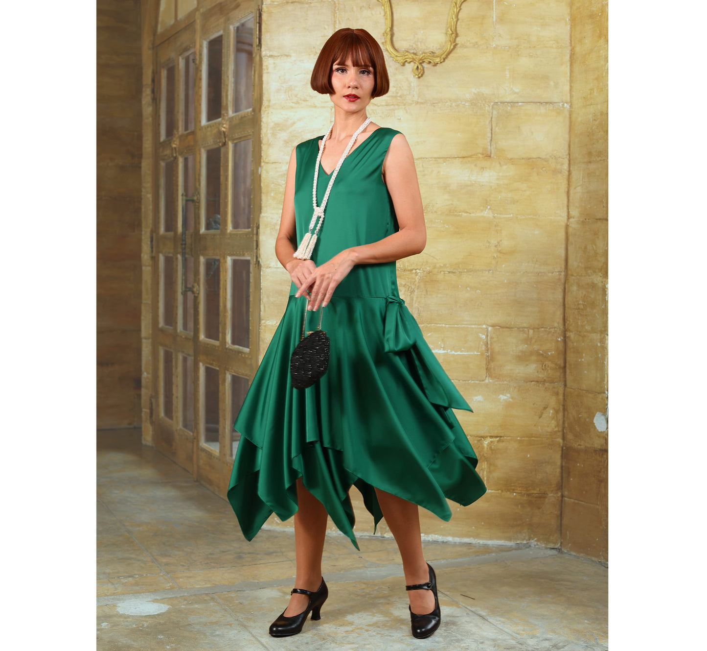 Satin roaring 20s party dress in green with handkerchief skirt