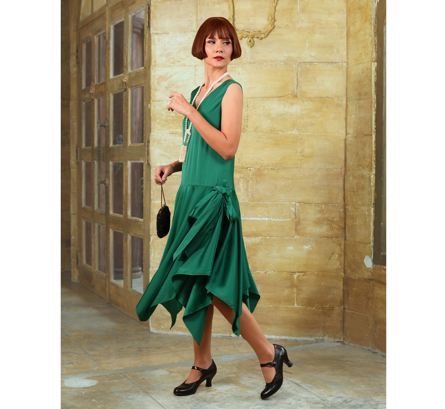 Satin roaring 20s party dress in green with handkerchief skirt