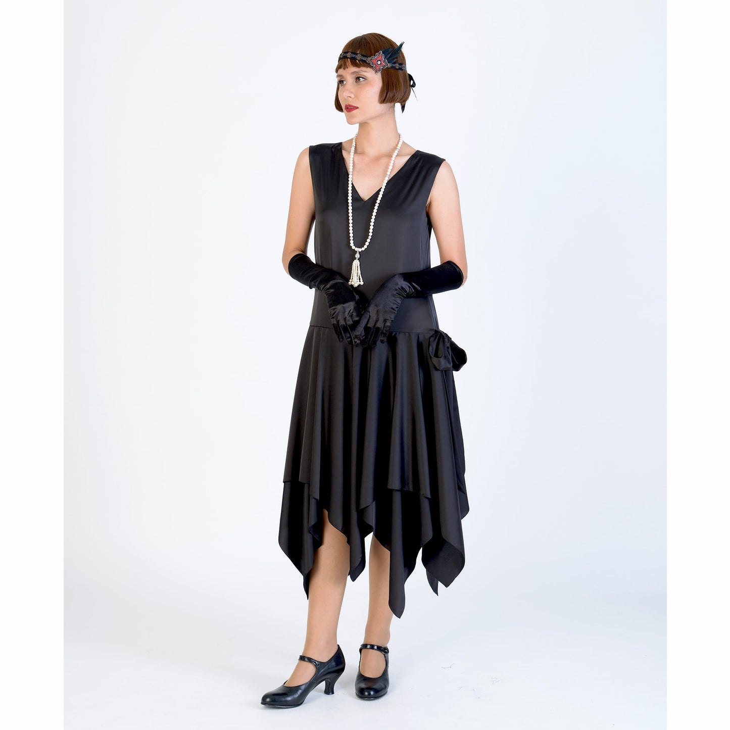 Black 1920s evening dress of satin with handkerchief skirt