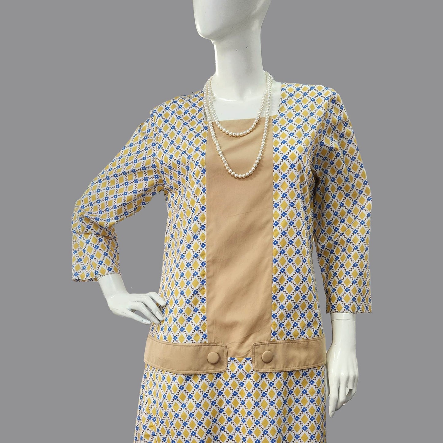 1920s dress in mustard diamond print and light-brown contrast panels