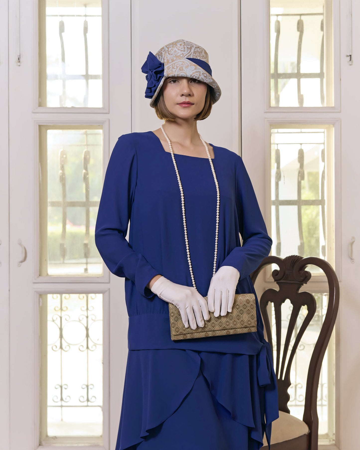 Light blue and brown cloche hat with dark blue ribbon - a flapper hat