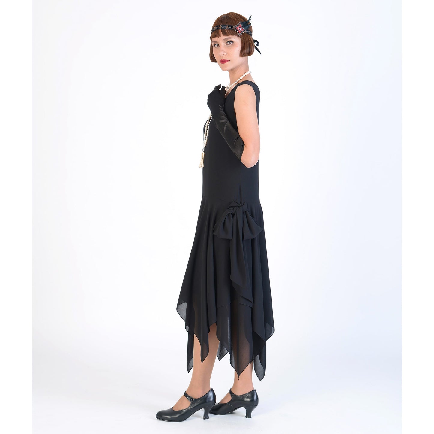 This black chiffon 1920s dress with a handkerchief skirt is great as a swing dance dress at any roaring 20s party.