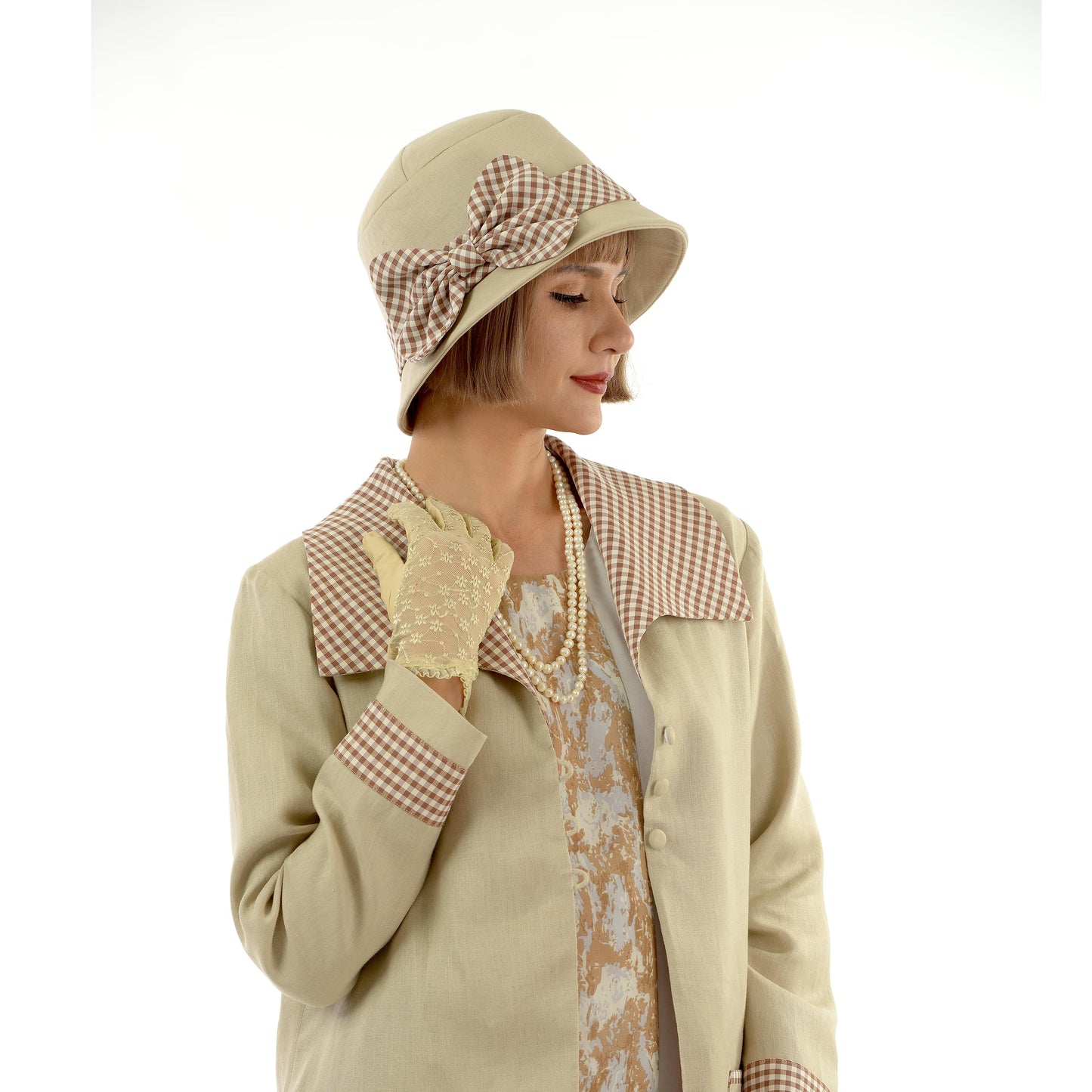 Light brown 1920s style linen cloche hat with plaid ribbon