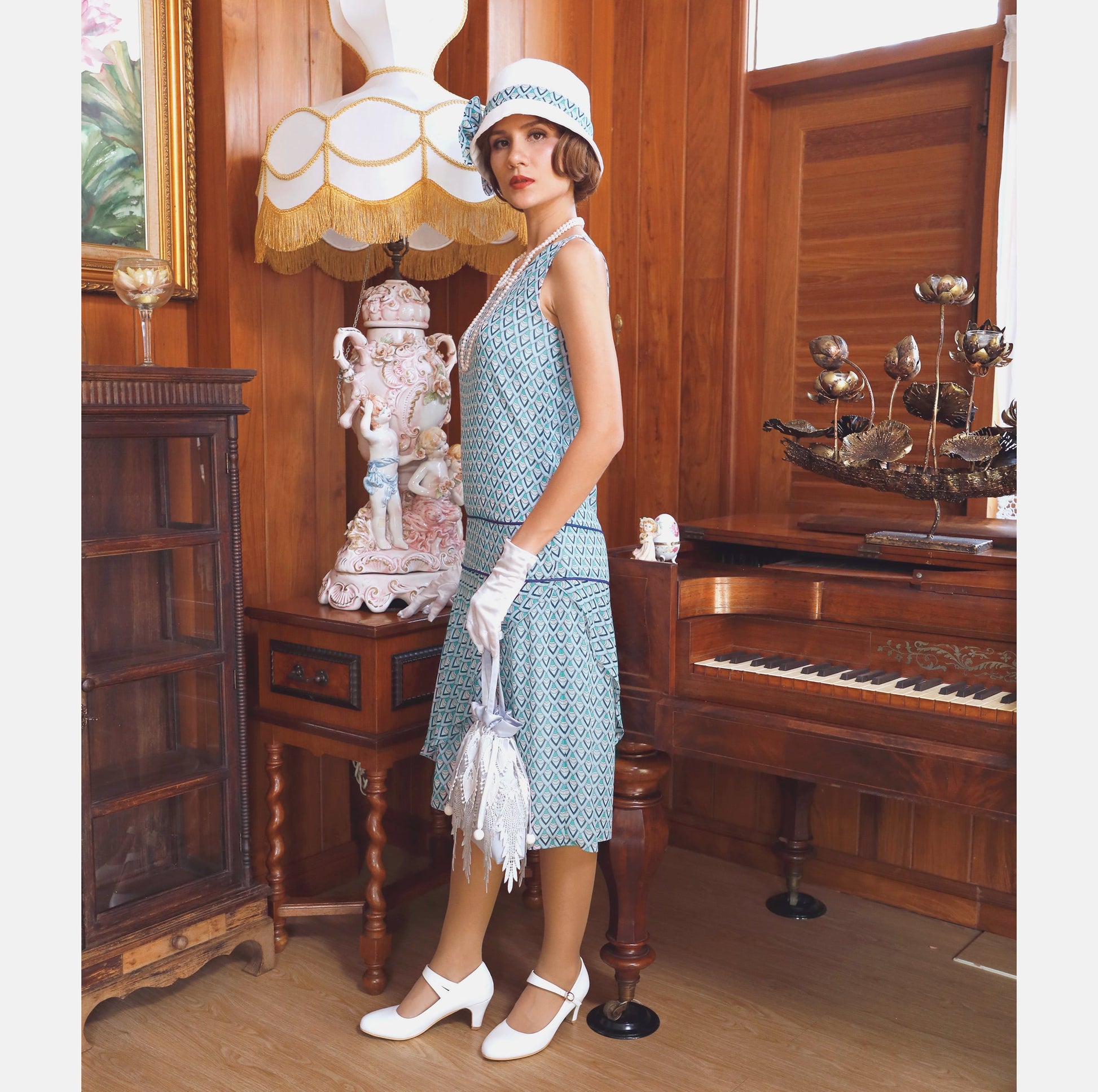 Light blue chiffon flapper dress with deco print and ruffled skirt. The roaring 20s dress can be worn as Great Gatsby dress, flapper dress or 1920s high tea dress.