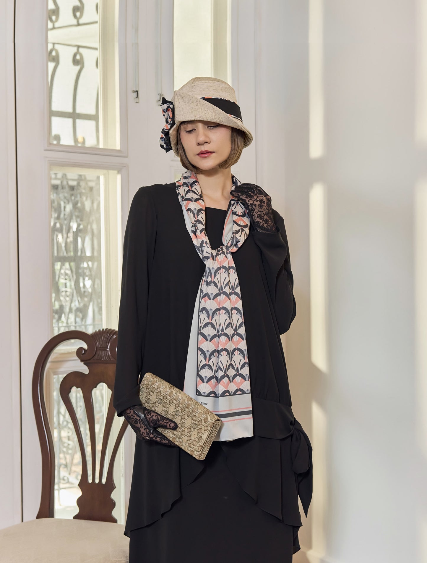 Cloche hat in cream color with art deco floral hat band