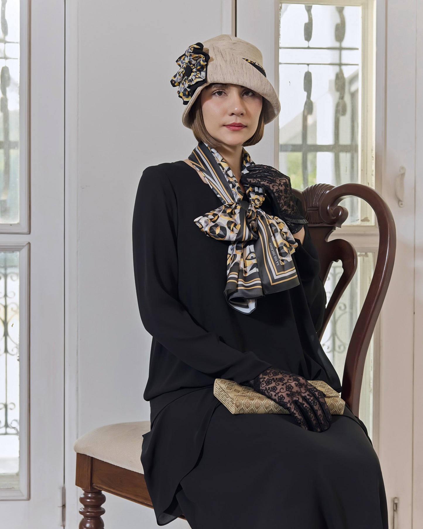 Cream Great Gatsby party hat with art deco floral hat band