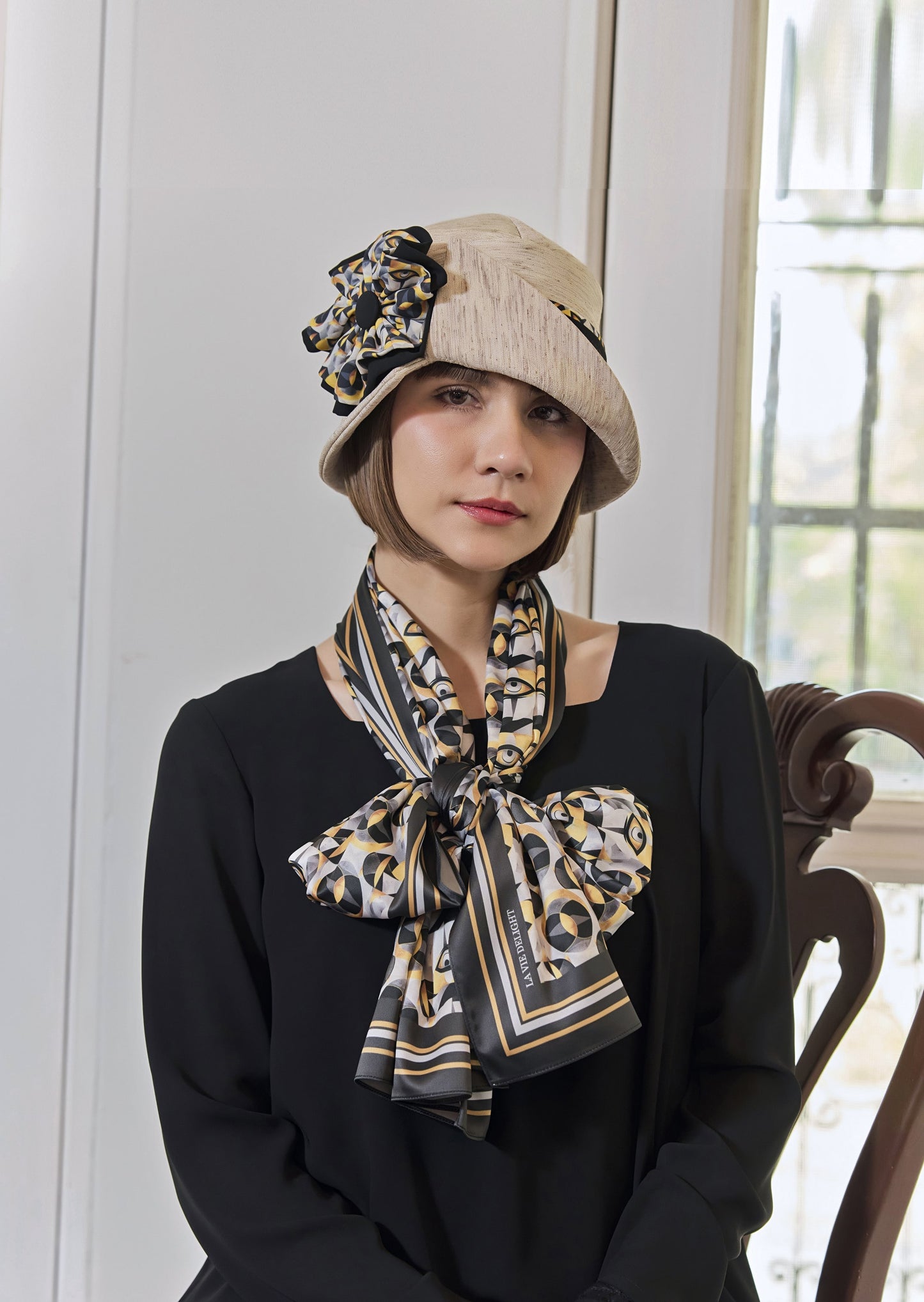 Cream Great Gatsby party hat with art deco floral hat band