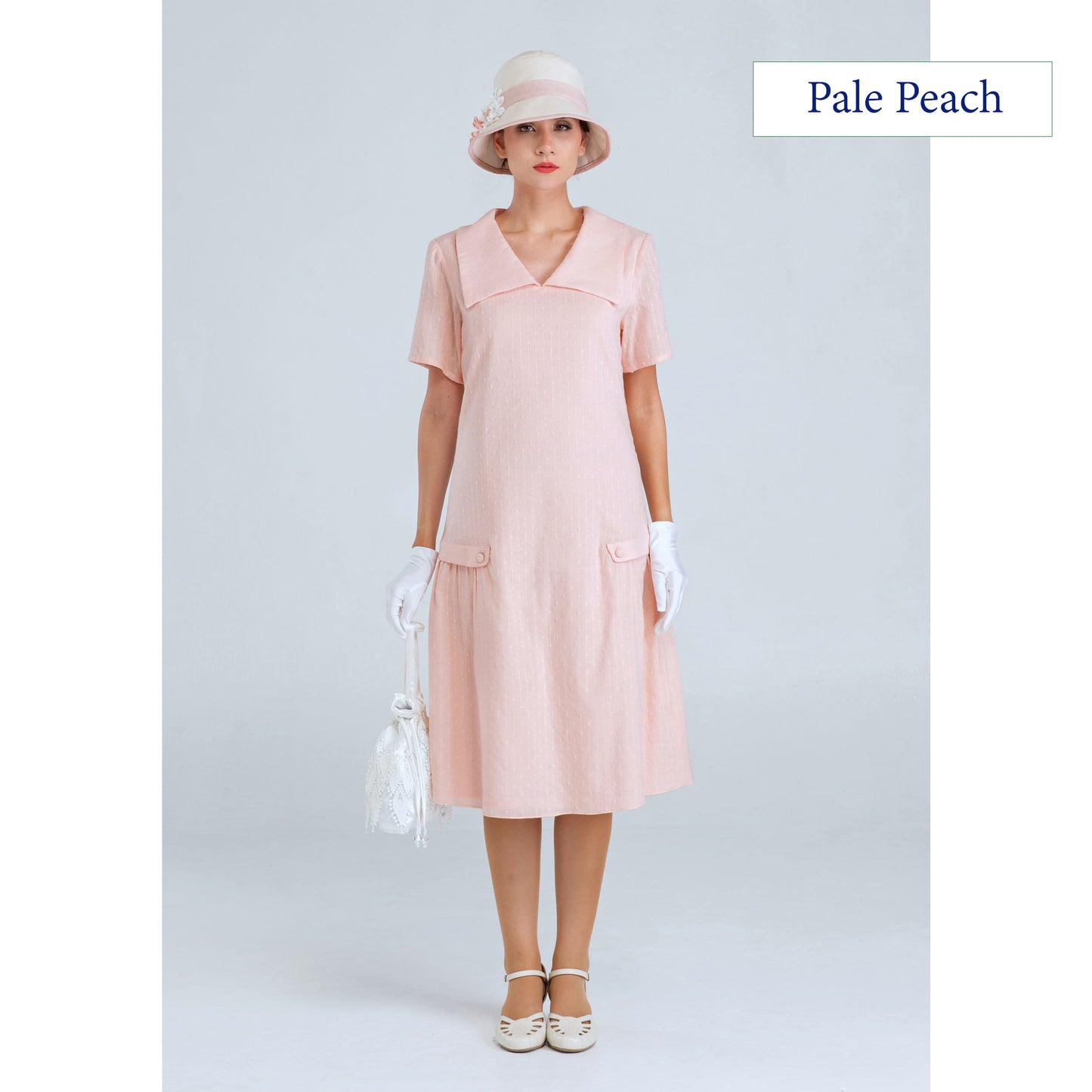 1920s dress of pale peach cotton with puritan collar and short sleeves