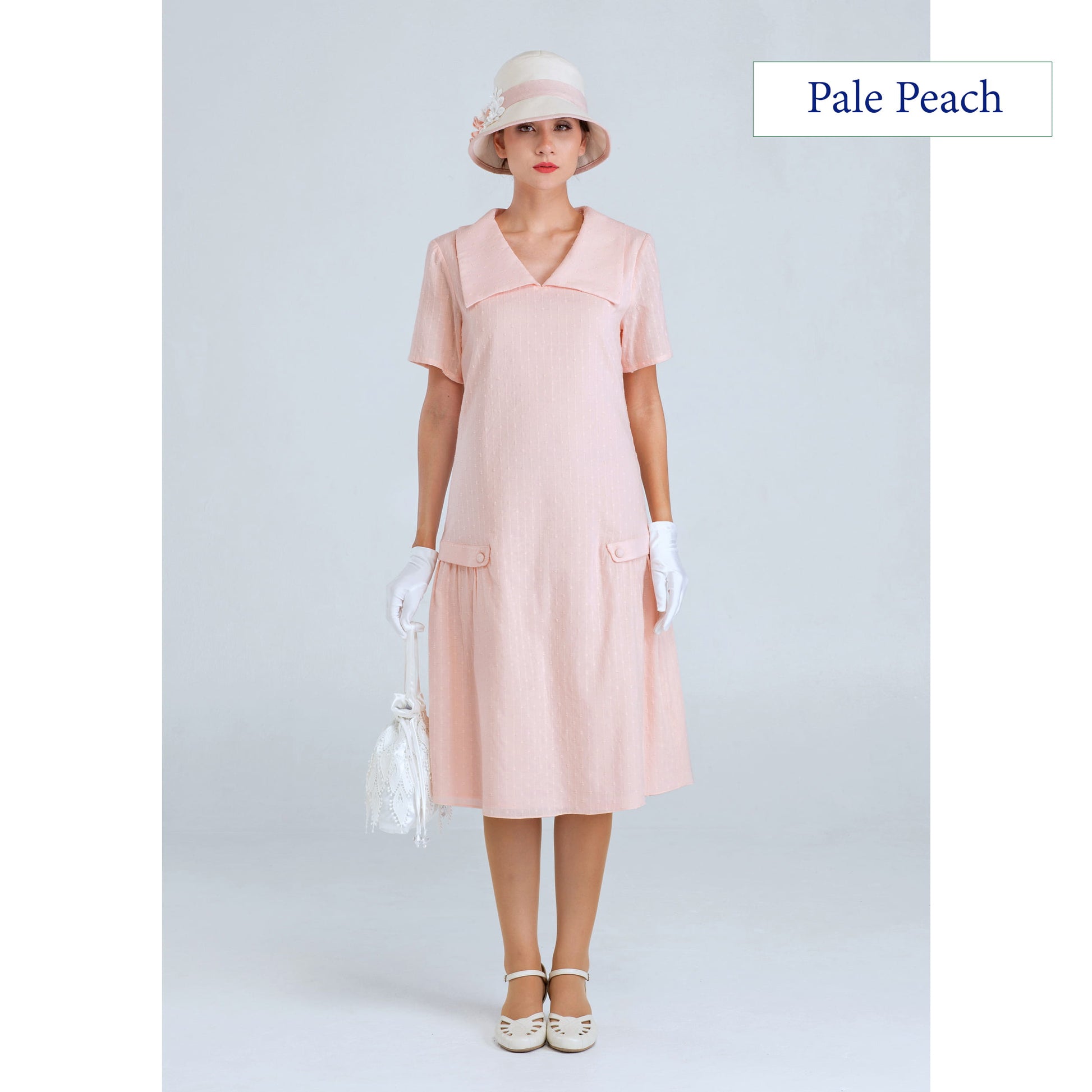 1920s dress of pale peach cotton with puritan collar and short sleeves