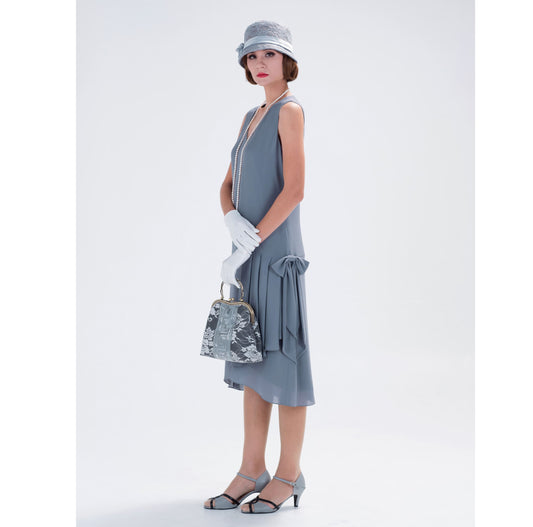 A handmade 1920s flapper dress that is made of chiffon in grey with drape and bow