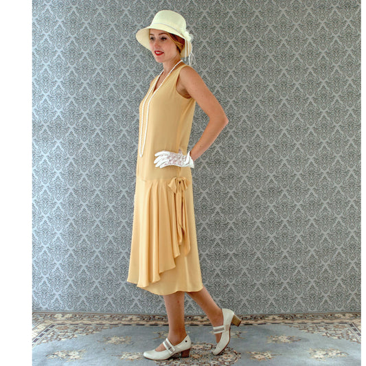 1920s-inspired flapper dress in pale marigold with drape and bow - a vintage-inspired Roaring Twenties dress
