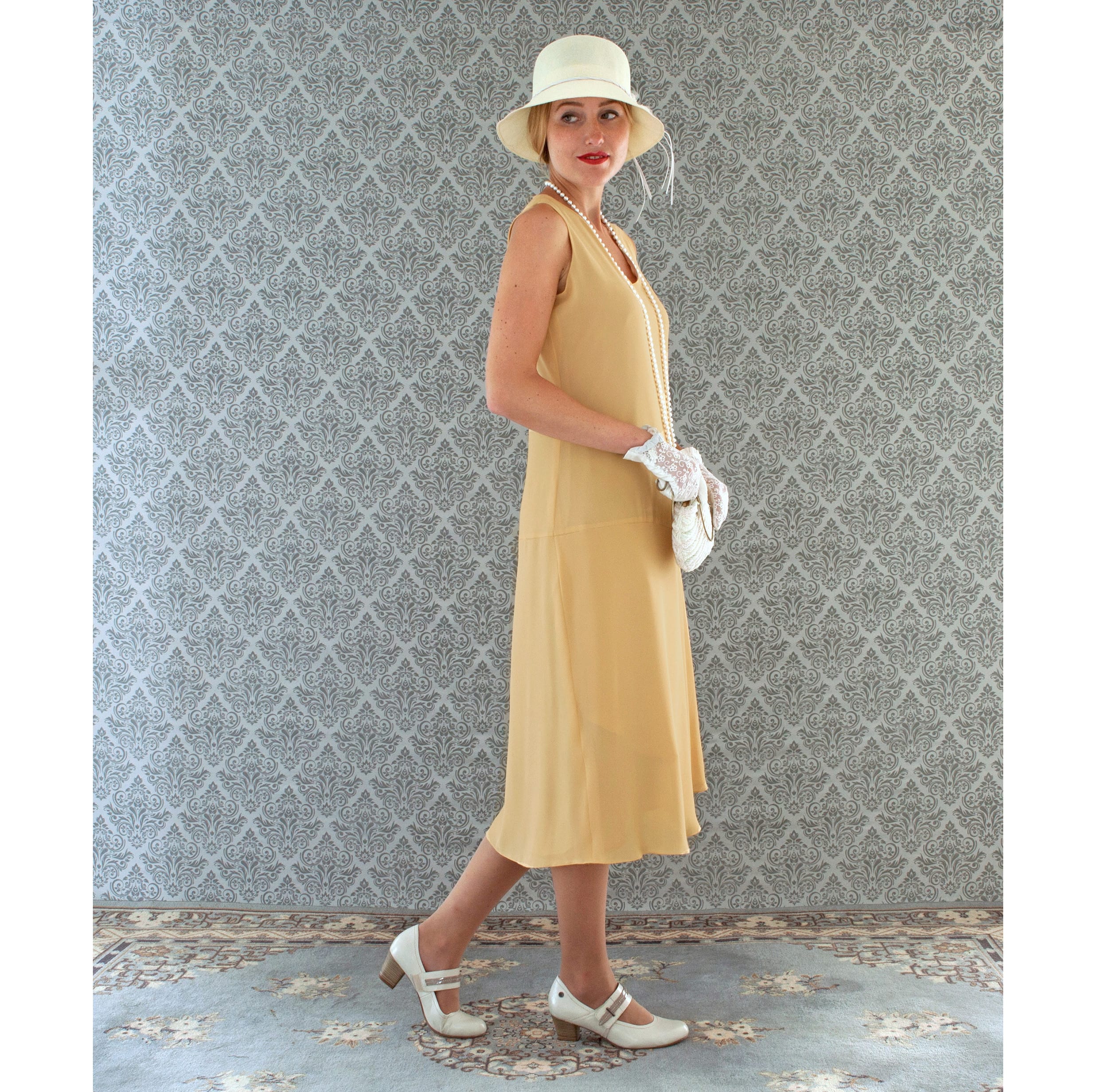 1920s-inspired flapper dress in pale marigold with drape and bow ...