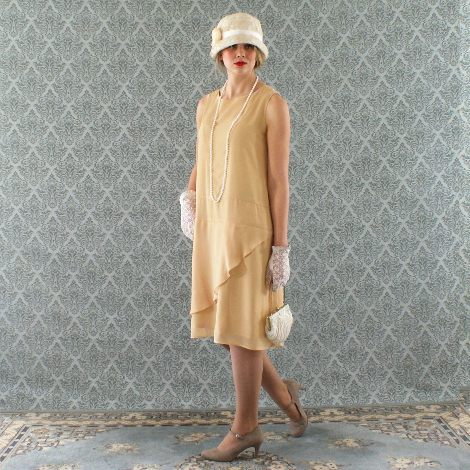 Pale marigold chiffon flapper dress with a ruffled skirt detail ...