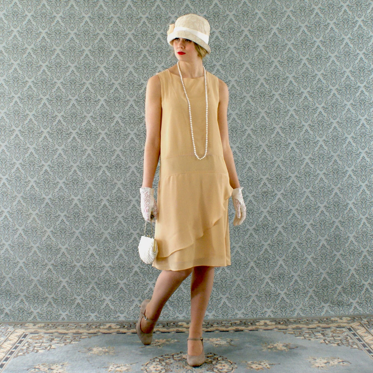 Pale marigold chiffon flapper dress with a ruffled skirt detail ...