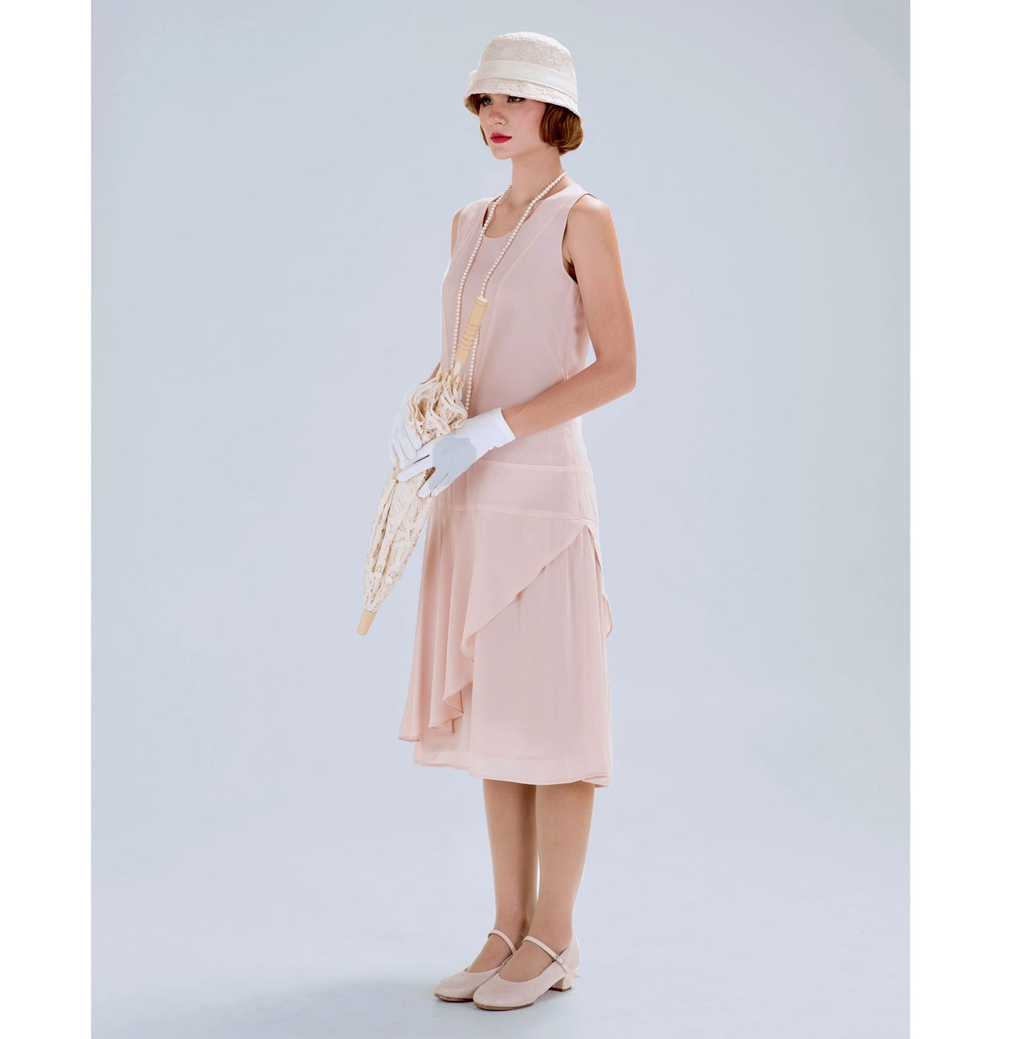 Nude jazz age chiffon flapper dress with a ruffled skirt detail