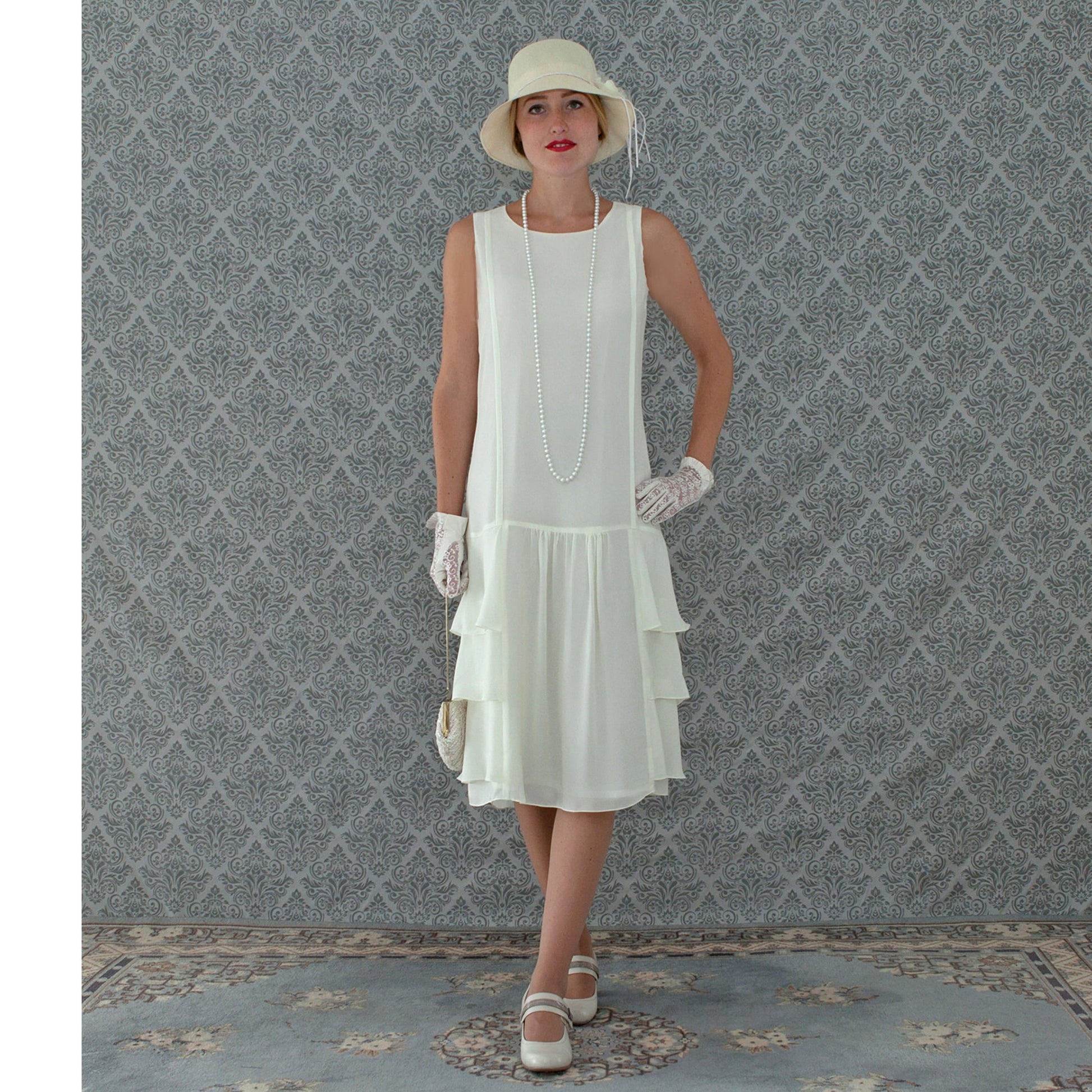 A darling 1920s-inspired dress in cream with tiered skirt