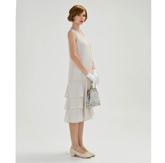 1920s dress in bleached linen color chiffon with tiered skirt. This roaring 20s fashion can be worn as a Great Gatsby dress or Downton Abbey dress.