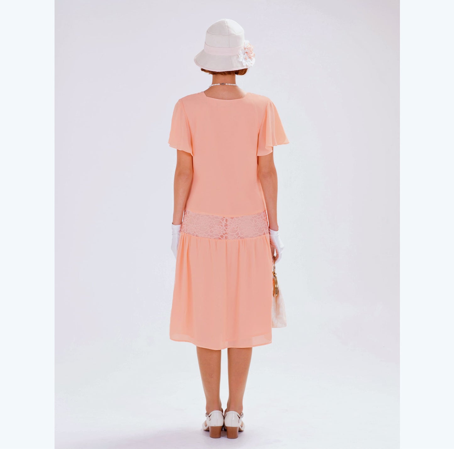 This Downton Abbey dress is made of peach chiffon and lace fabrics. The 1920s dress can be worn as a 20s high tea dress, a flapper or Gatsby dress.