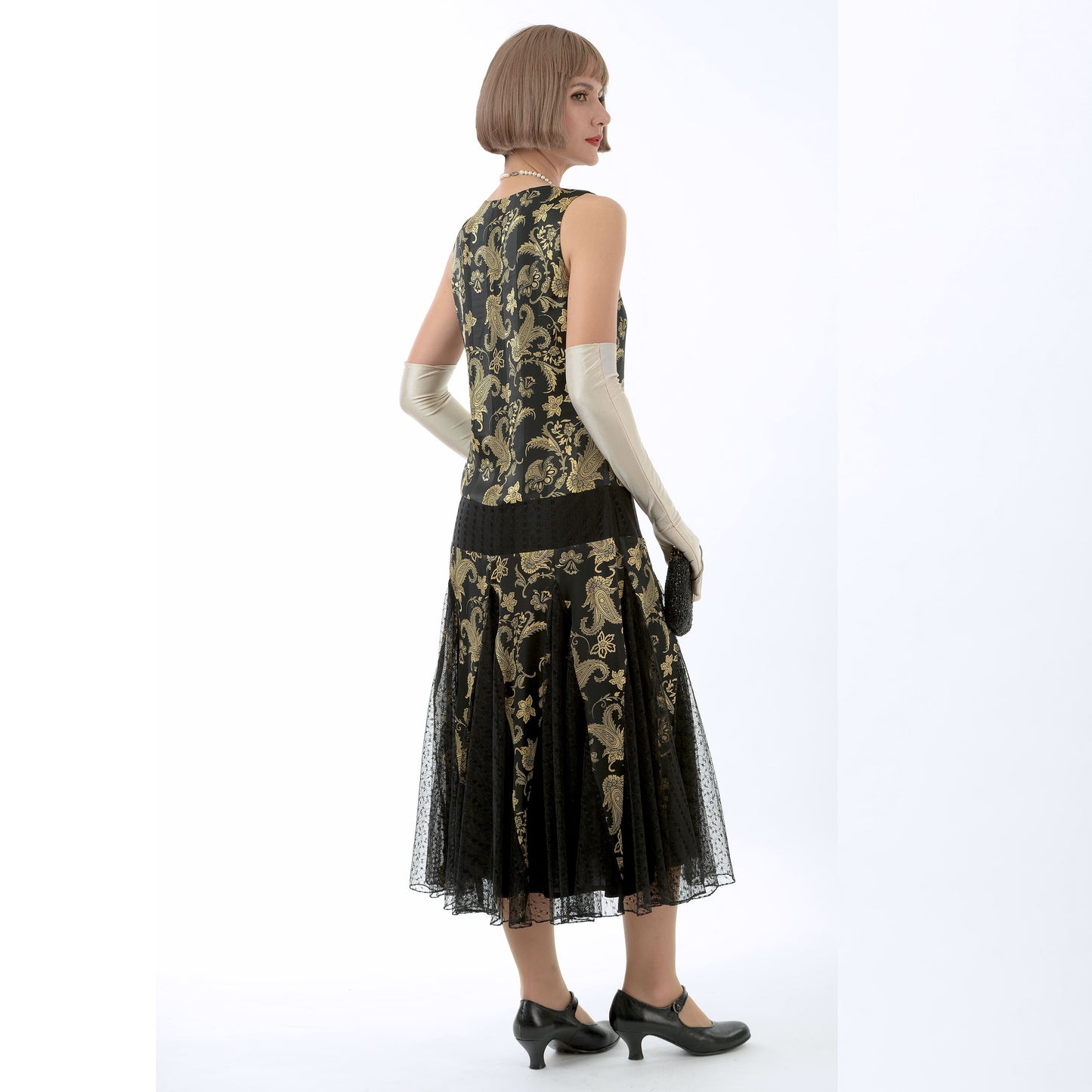 1920s evening dress in black and gold satin with black skirt godets