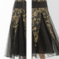 1920s evening dress in black and gold satin with black skirt godets
