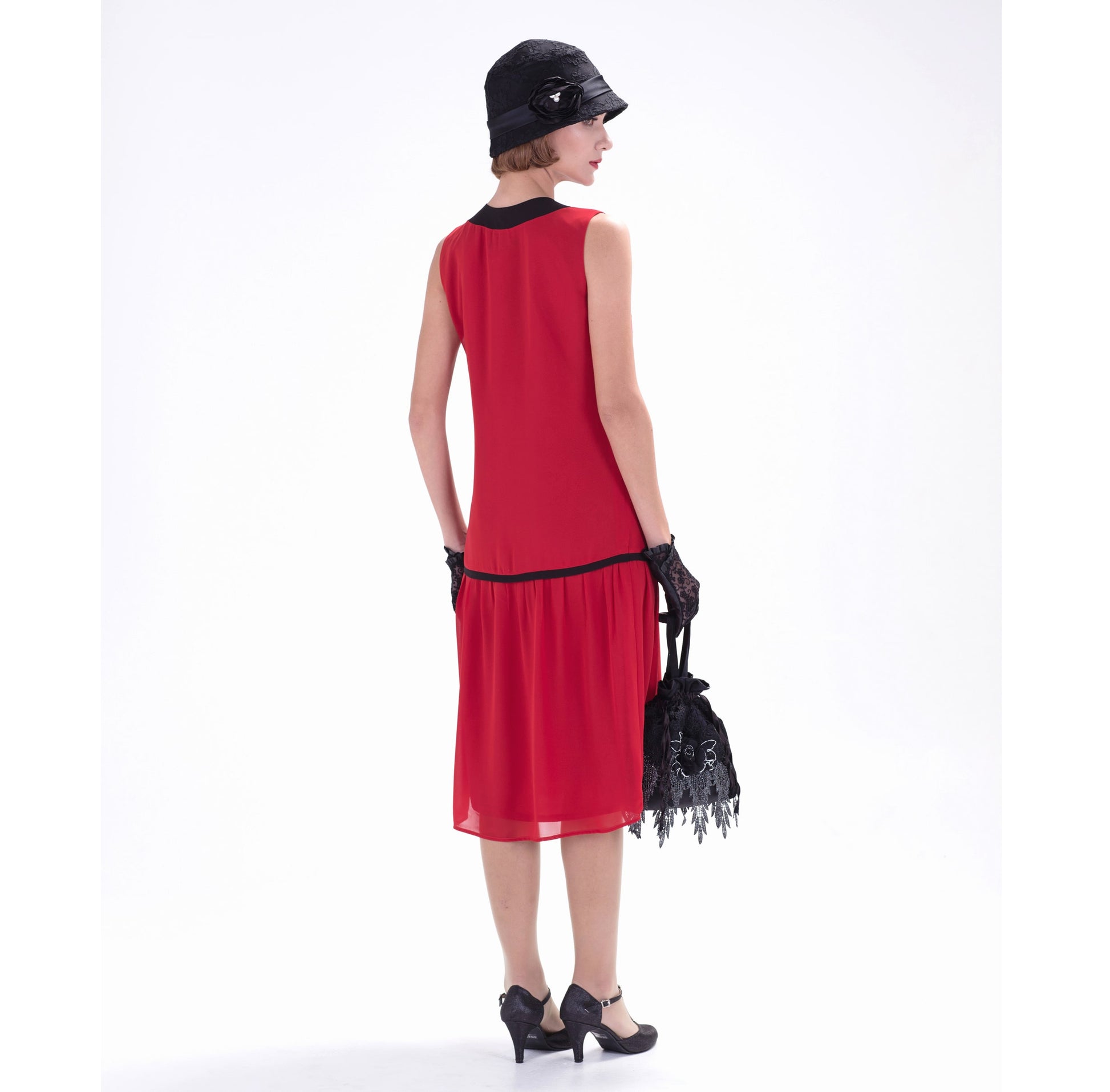 Red chiffon flapper dress with contrasting black details. This 1920s dress can be worn as a a Great Gatsby dress or Jazz Age party dress.