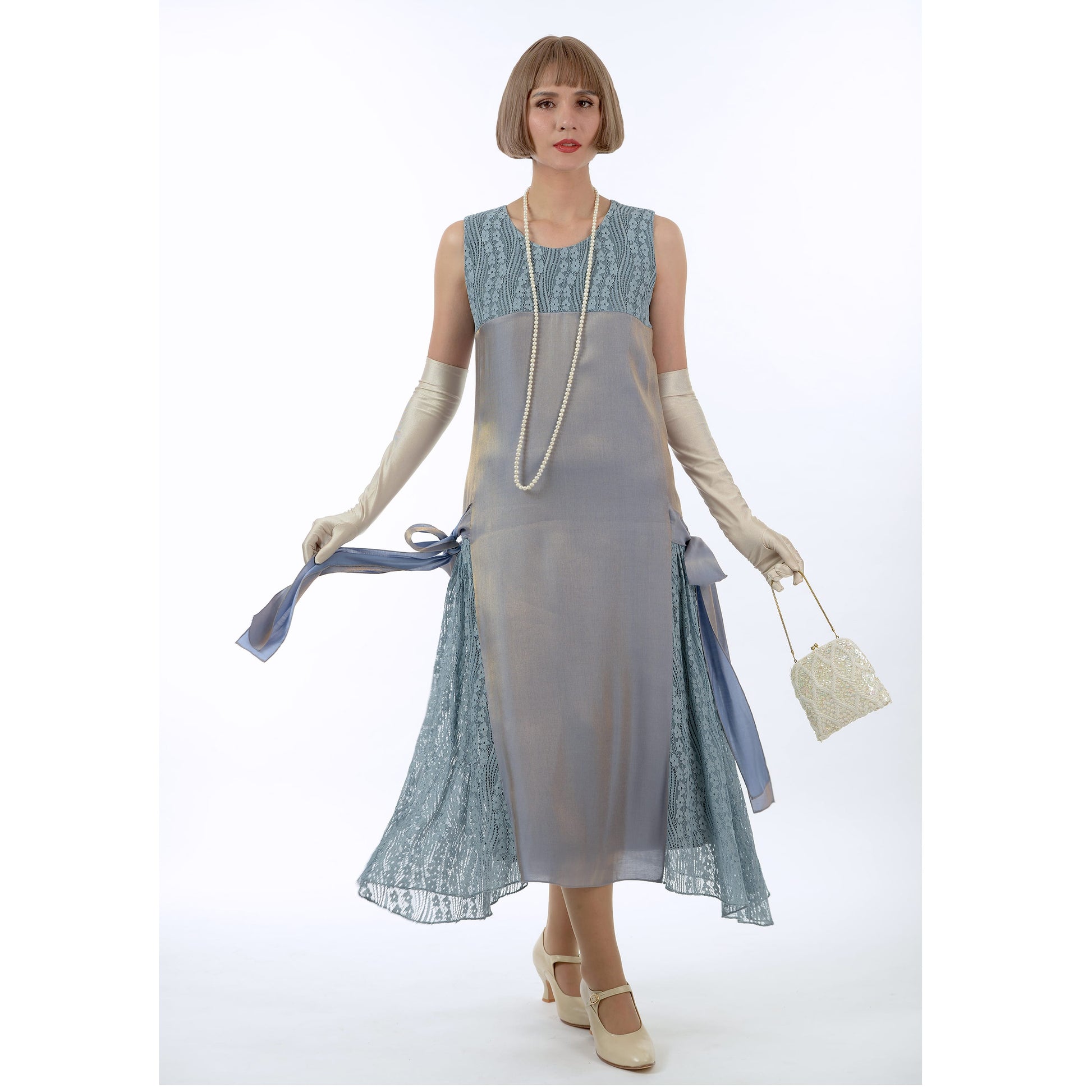 A grey formal 1920s evening dress made of thin metallic (coated) polyester fabric and lace,