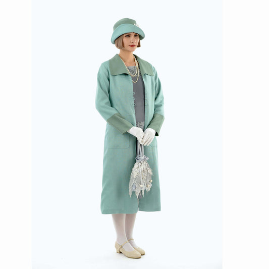 A pastel blue summer linen 1920s coat with muted green details and a wing collar for any roaring twenties event.