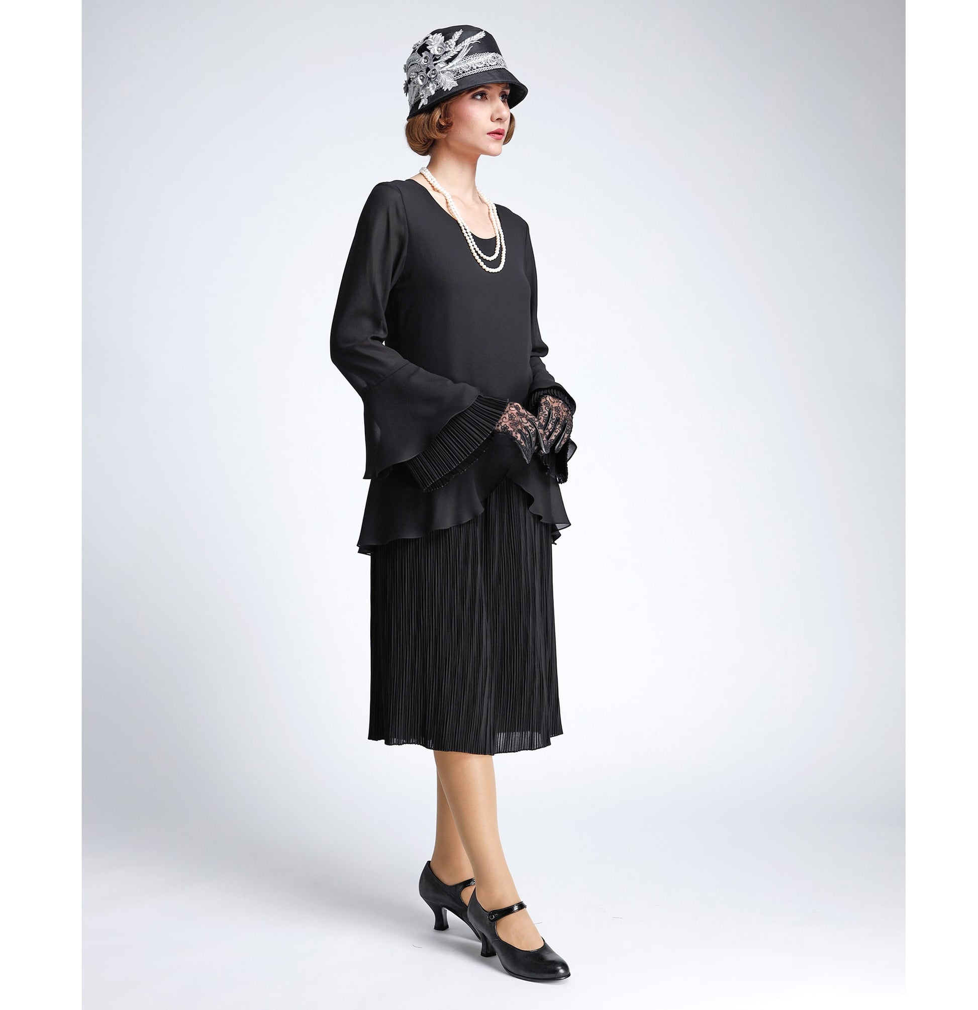 This black chiffon 1920s dress with plisse pleat details can be worn as a Great Gatsby dress or a Downton Abbey dress. 