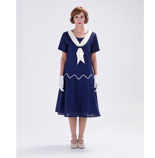 Cotton 1920s reproduction day dress in navy blue with white contrast details. The flapper can be worn as a Great Gatsby dress, 1920s sailor dress or roaring 20s tea dress.
