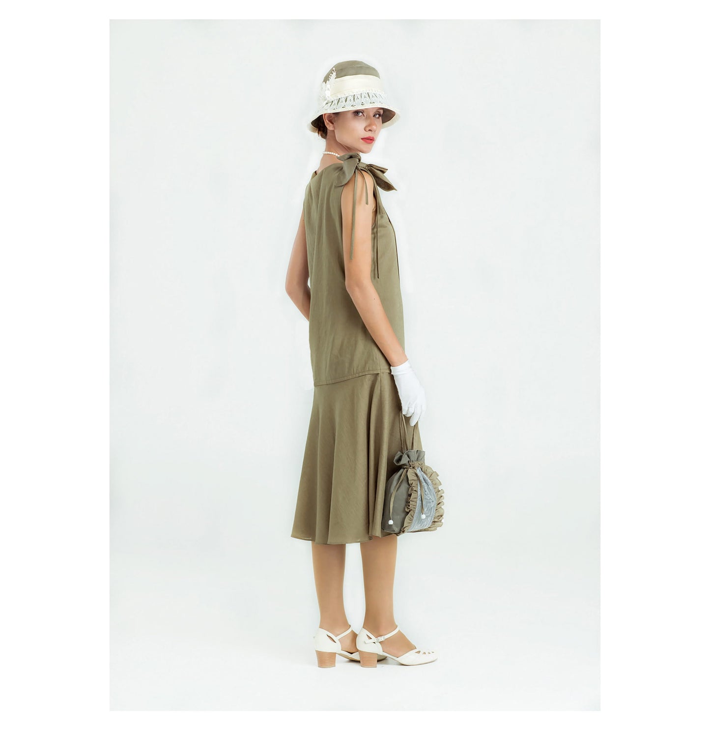 Sleeveless 1920s linen dress in olive green with bow on shoulder