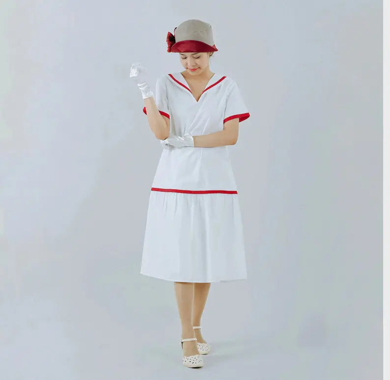 White cotton 1920s sailor dress with navy or red trim - a roaring twenties inspired dress