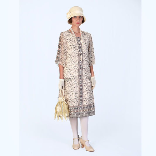 A lovely 1920s dress with elbow sleeves, made of printed cream chiffon. Suitable for 20s high tea events