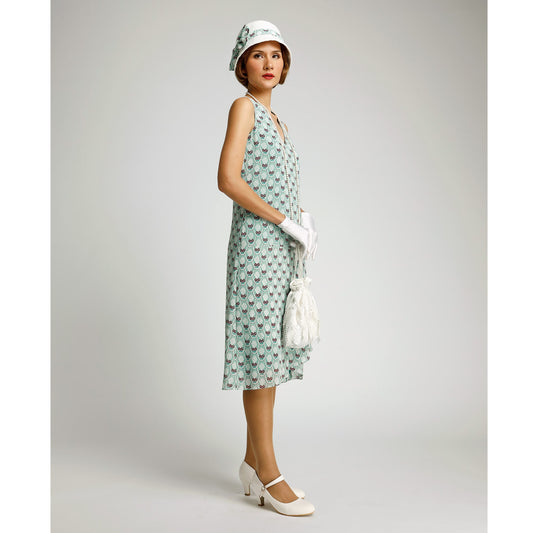 1920s day dress in green deco print with drape and bow. This 1920s fashion dress can be worn as Downton Abbey dress or Great Gatsby summer dress.