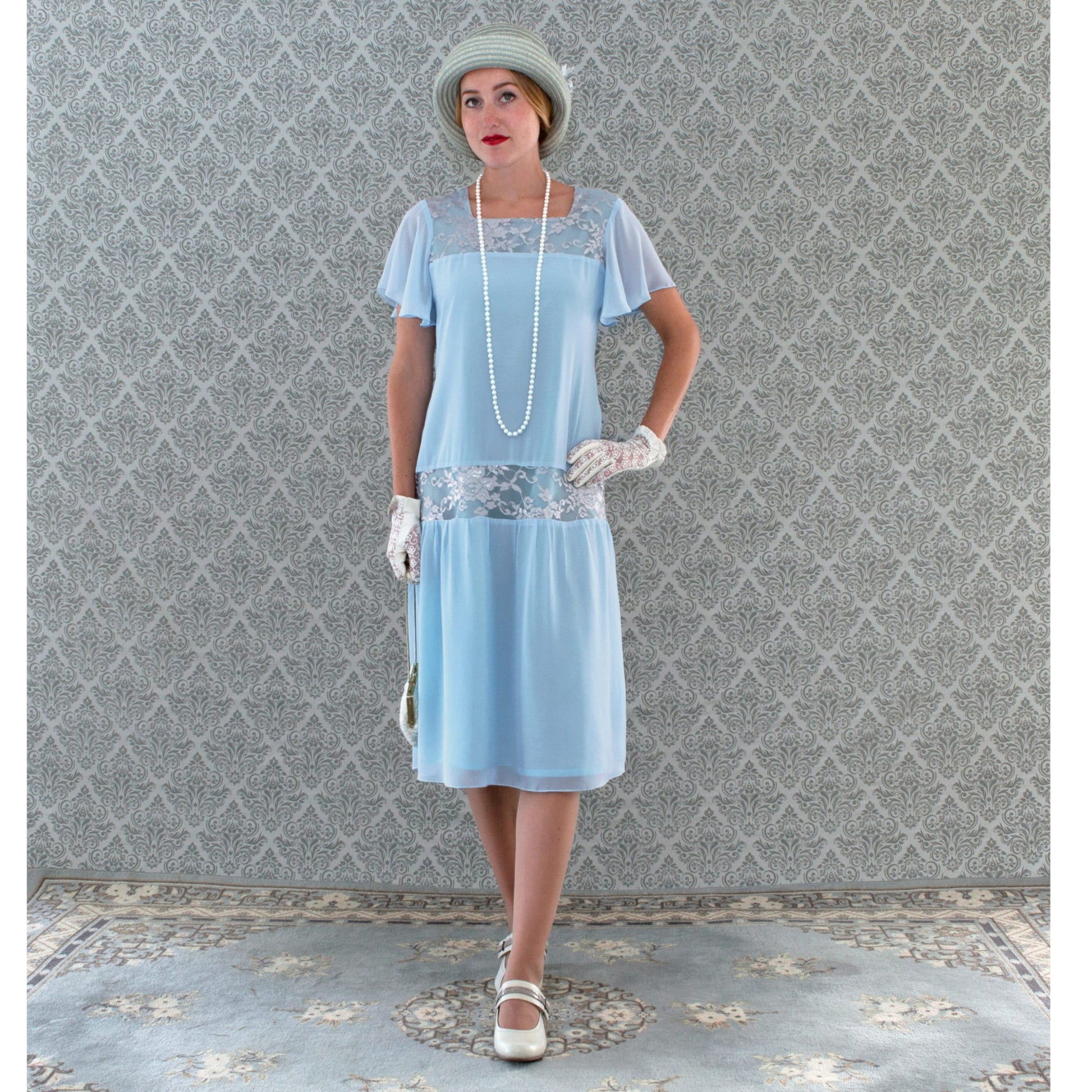 Great Gatsby day dress inspired by 1920s fashion made of light blue chiffon and silver grey lace fabrics and with flutter sleeves. 