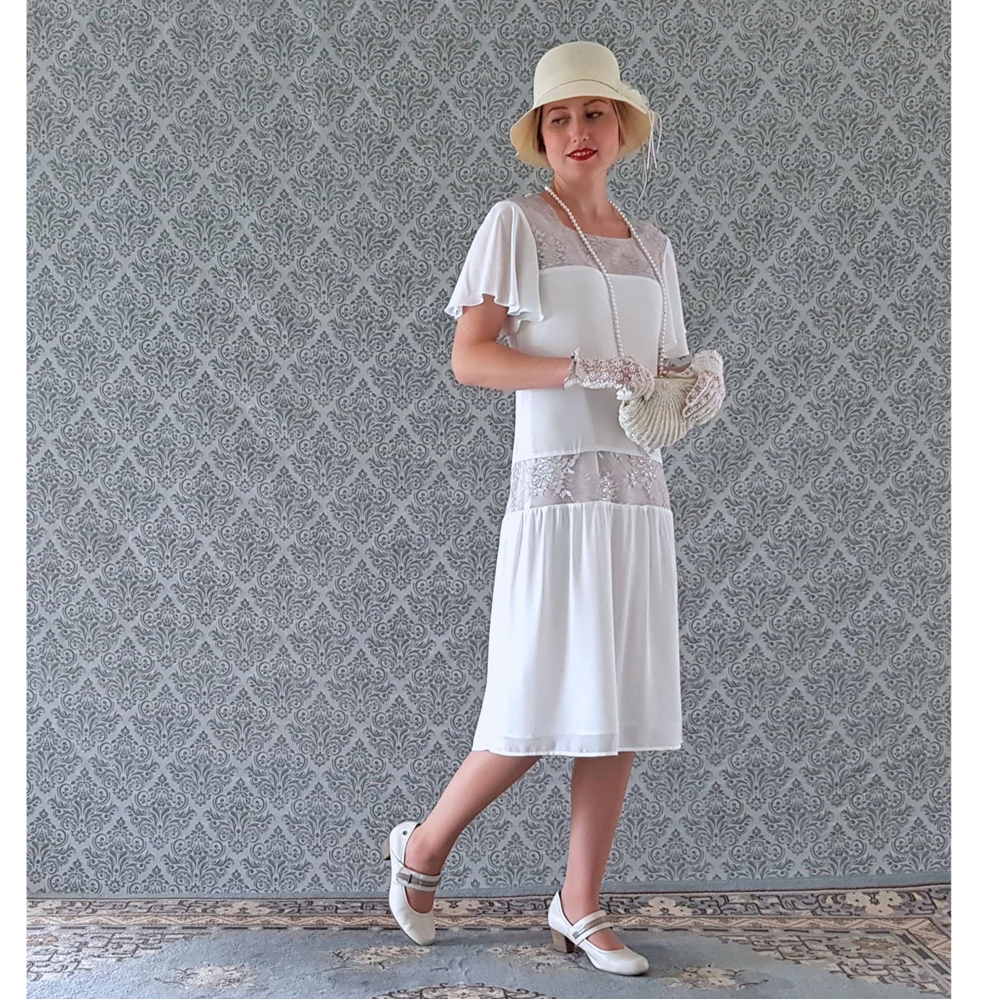 This 1920s dress, or Great Gatsby dress or Downton Abbey dress, is made of chiffon fabric in off-white and silver grey lace, also suitable as wedding dress.