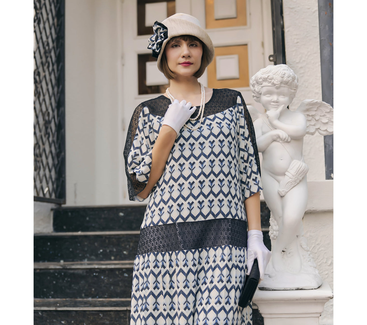 1920s art deco dress made of chiffon and with lace insets and elbow sleeves