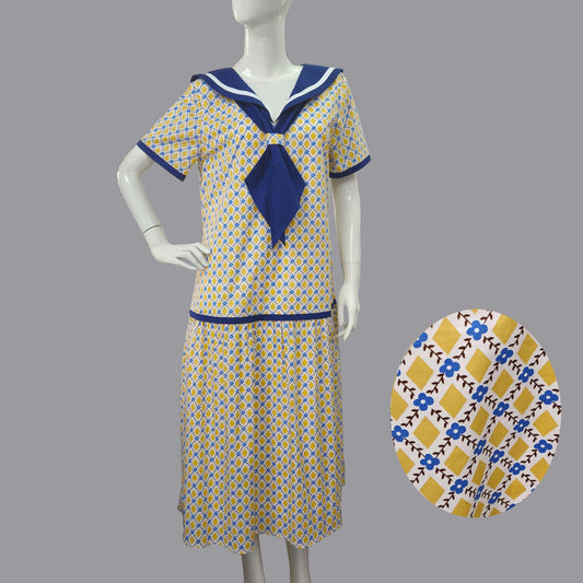 Sailor-style 1920s dress in mustard diamond print and blue neckline