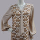 Mannequin wearing an Art Deco dress with a brown feather print pattern 