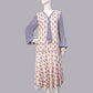 1920s fashion dress with a cheerful Art Deco pattern in light pastel shades