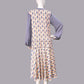 1920s fashion dress with a cheerful Art Deco pattern in light pastel shades