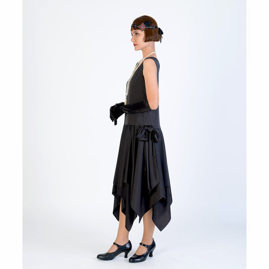 Black 1920s evening dress of satin with handkerchief skirt