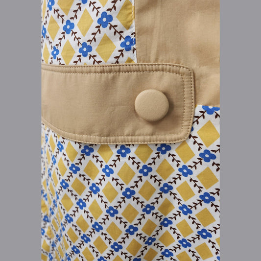 1920s dress in mustard diamond print and light-brown contrast panels