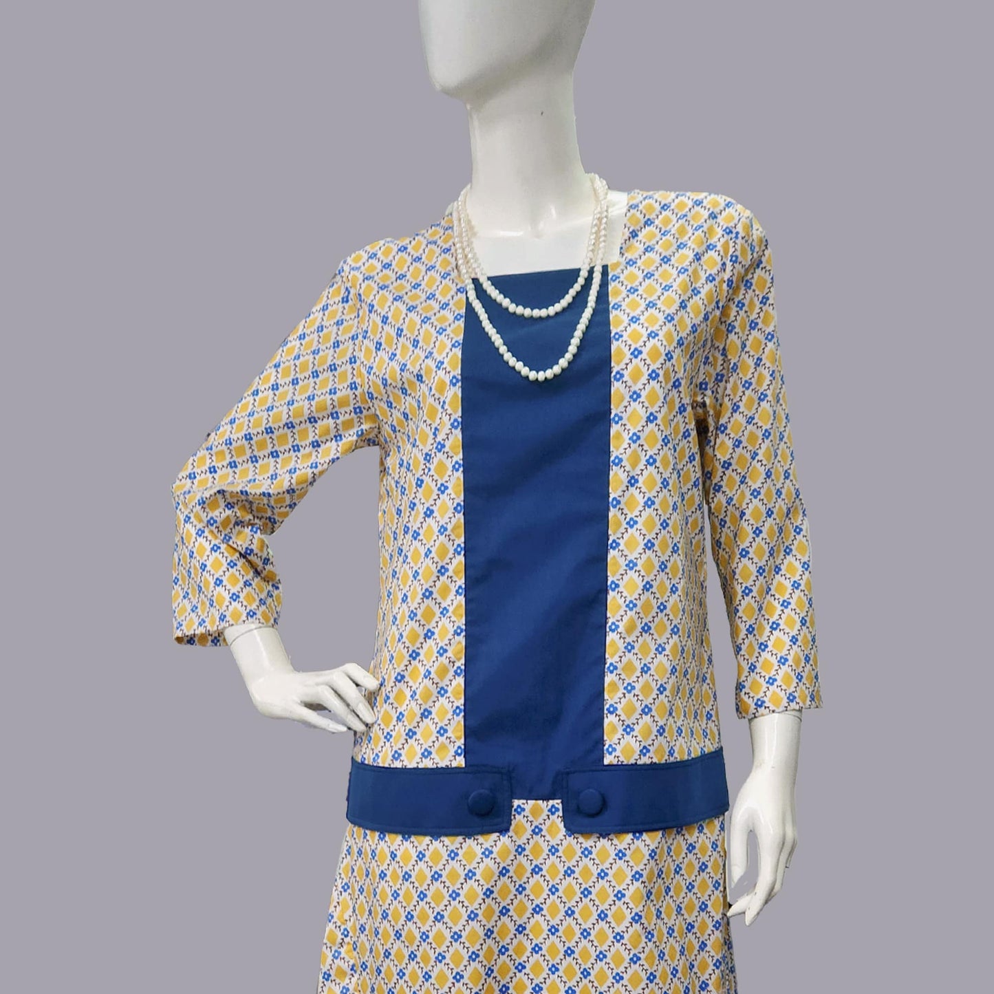 1920s dress in mustard diamond print and dark blue contrast panels
