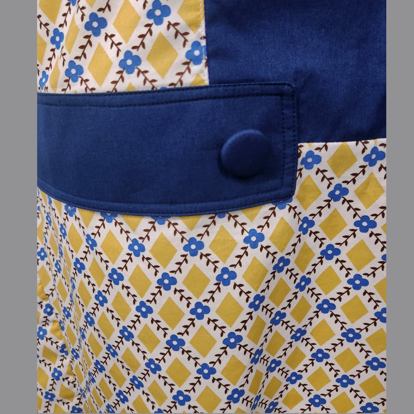 1920s dress in mustard diamond print and dark blue contrast panels