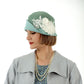 1920s-inspired linen cloche hat in muted green and pastel blue